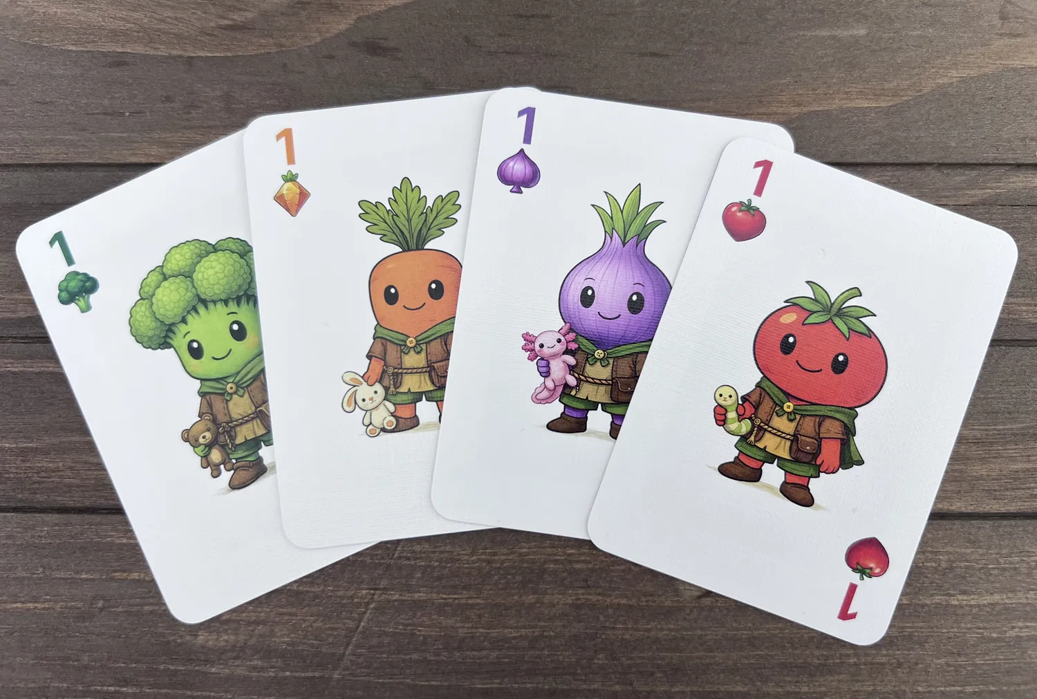 Skip the Salad! veggie suit cards fanned out: Broccoli, Carrot, Onion, and Tomato